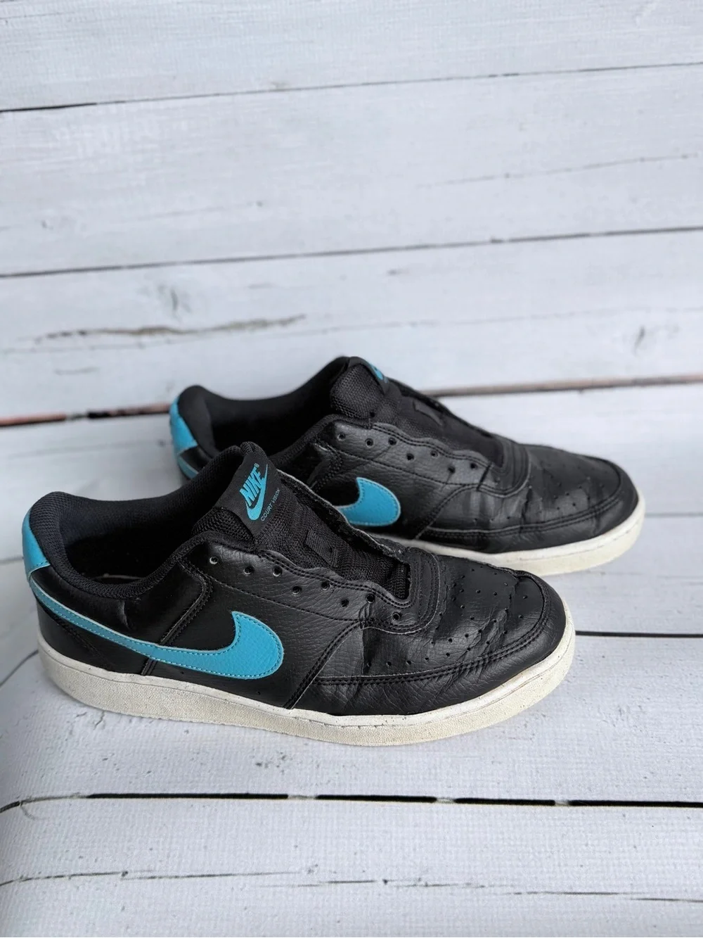 Nike Men’s Black Sneakers with Blue Swoosh